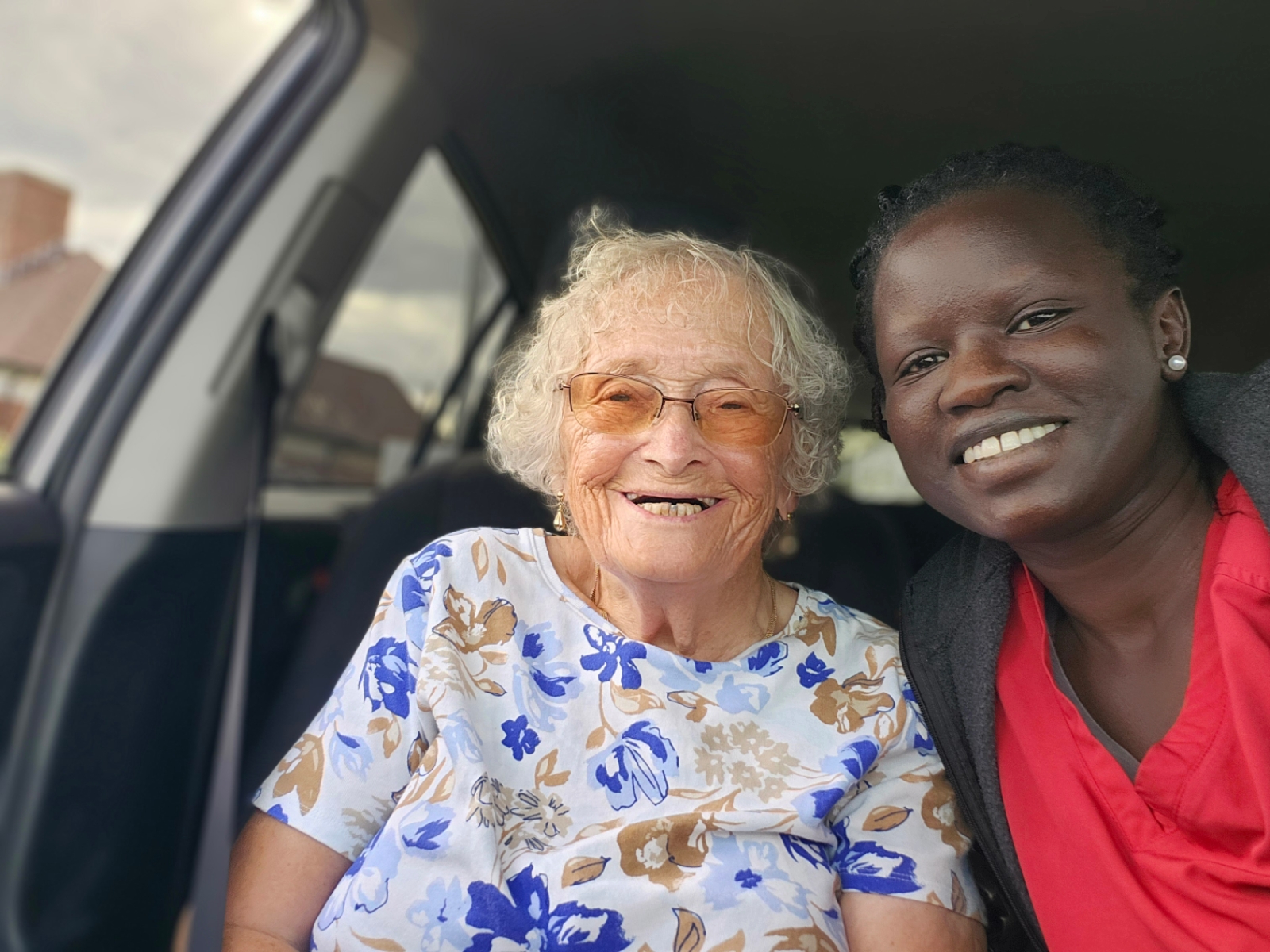 Mayola’s founder and a client smiling together during an outing.